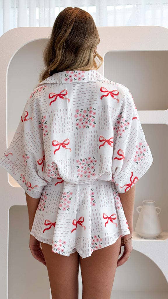 Bow printed oversized Button short sleeve romper in red for wholesale on Faire7