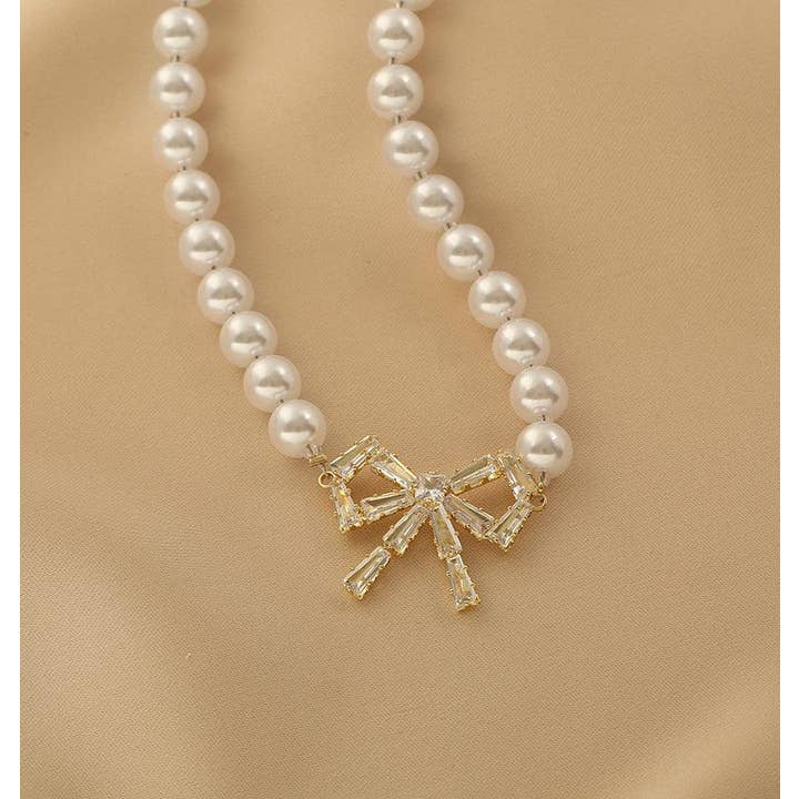 Gold Ladies Lux Fake Pearl Bowknot Necklace SKAJ015 for wholesale on Faire1