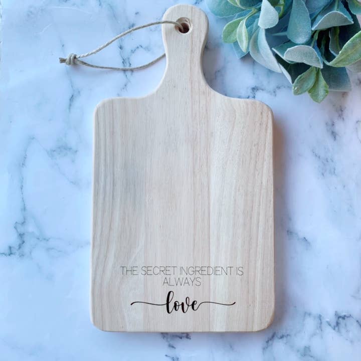 The Secret Ingredient is Always Love Serving Cutting Board for wholesale by M.Ree Jewels Creative