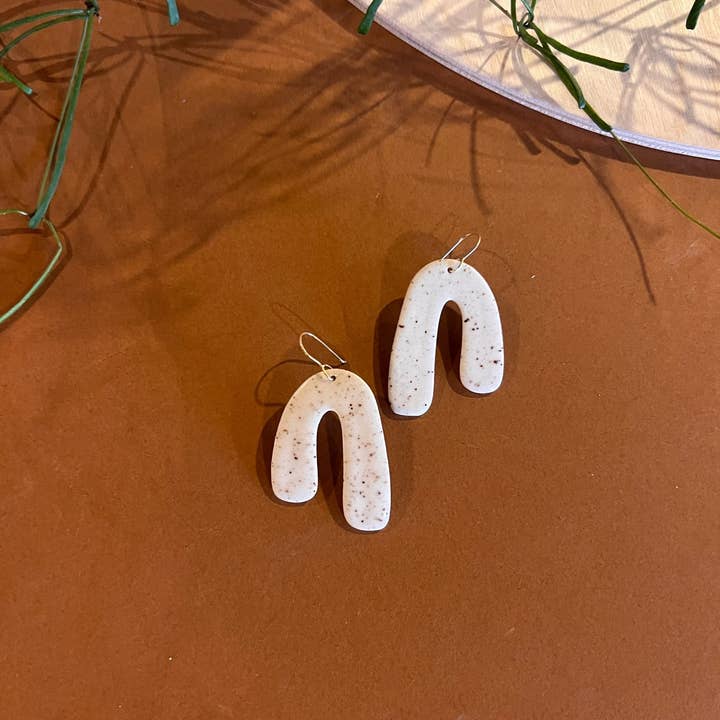 Large Asymmetrical Arch Dangle Earring for wholesale by Klei Ceramics