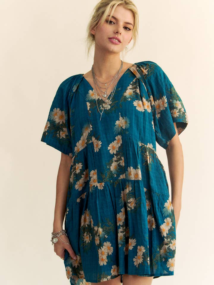 Teal Blue FLORAL PRINT SHORT BELL SLEEVE PLEATED MINI DRESS for wholesale on Faire