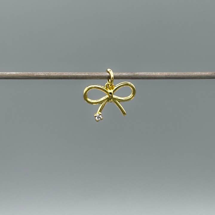 Gold Mini CZ Ribbon Bow Charm for wholesale by Something Silver