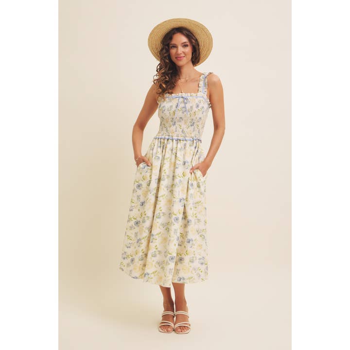 SMÖRKRÄM BLÅ Blommig midiklänning med smock och rosett för wholesale på Faire1