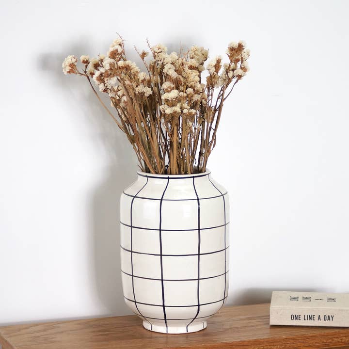 Decorative terracotta vase with black & white checkered pattern for wholesale by Bohome Living