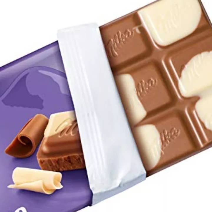 Phoenix Distributions - Venta al por mayor Chocolate - MILKA - Happy Cow, 100 gramos, 23 unidades
