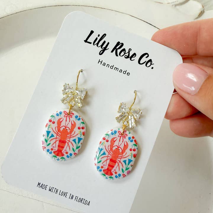 Lily Rose Co. - Wholesale Dangle Earrings - Lobster Print With Bows