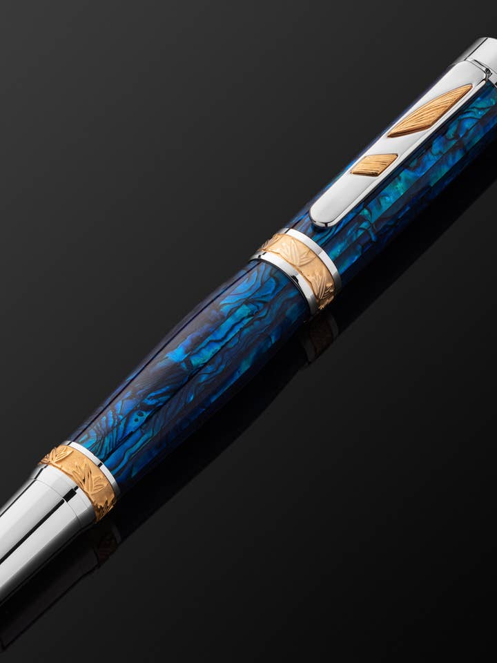 PITCHMAN RAINMAKER™ ROLLERBALL PEN - Handcrafted of Sapphire colored Paua Abalone Shell, 22 Kt Gold, and Rhodium - Limited Production for wholesale by Pitchman®
