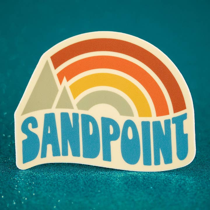 Sandpoint Idaho - Vinyl Sticker - Rainbow Sunset for wholesale by Little Hiker Bird