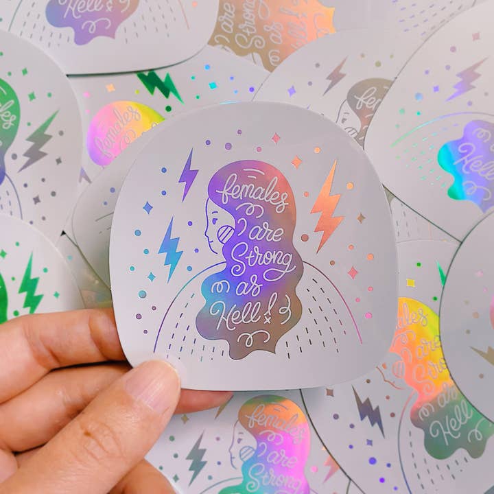 Females Are Strong As Hell Holographic Sticker for wholesale by Annlettering