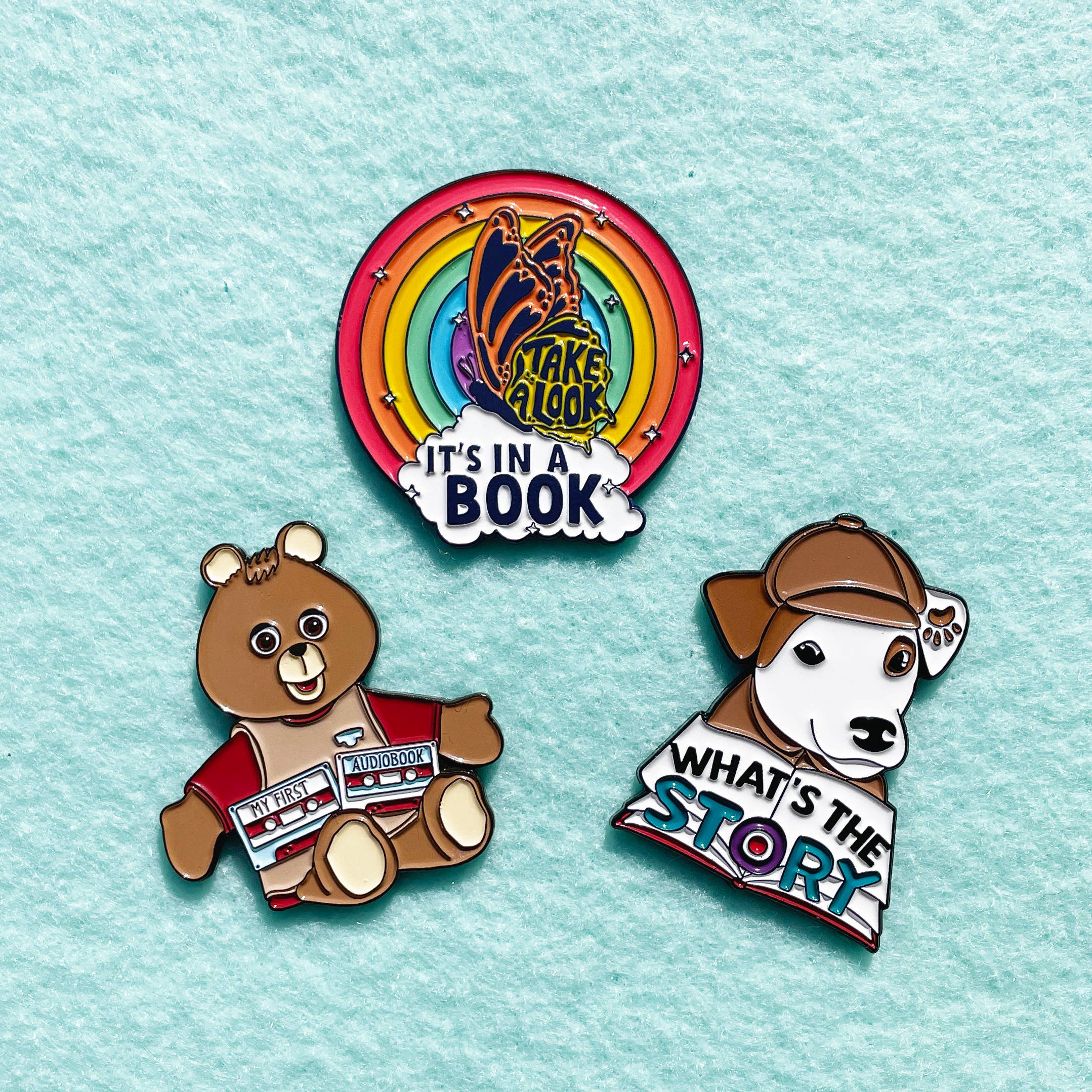 Pixel & Ink Creative - Wholesale Lapel Pin/Button - It's In A Book Rainbow Reading Enamel Pin | Pop Culture2