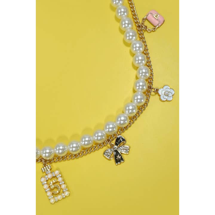 Gold CHAIN BAG CHARM-PEARL CHAIN BOW FLOWER PURSE | 40KC123 for wholesale on Faire