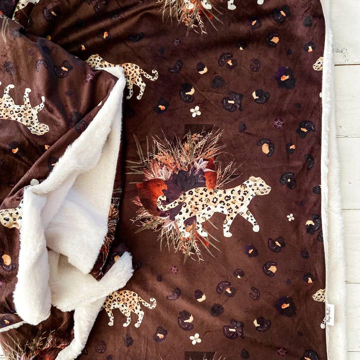 into the WILD Florals Throw Blanket for wholesale by Oxeye Floral Co.