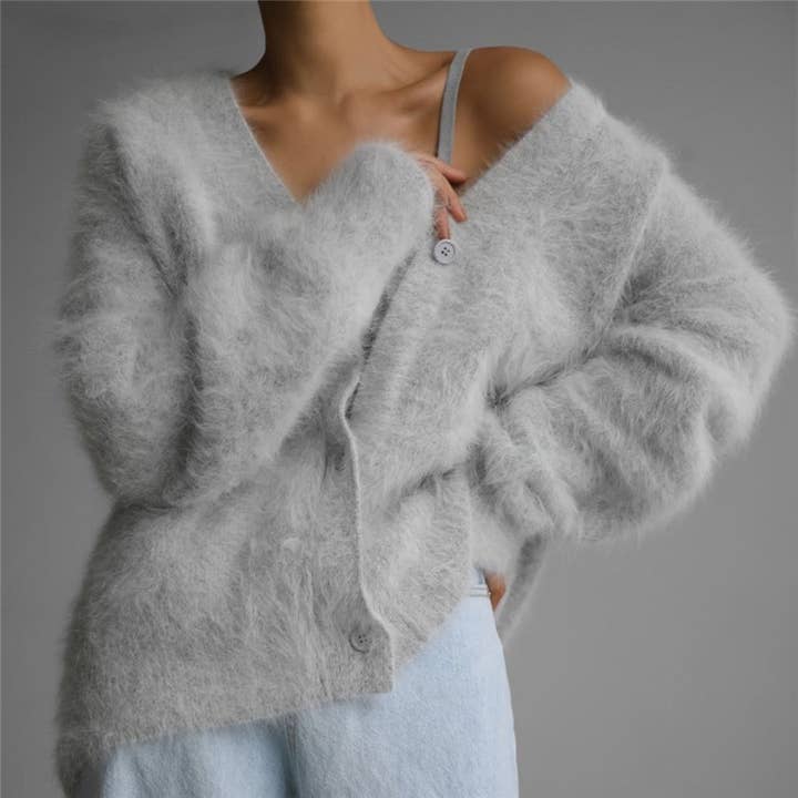 Cardigan a maniche lunghe con scollo a V e bottoni a tinta unita. per la vendita all'ingrosso da parte di UZ Wholesale Store