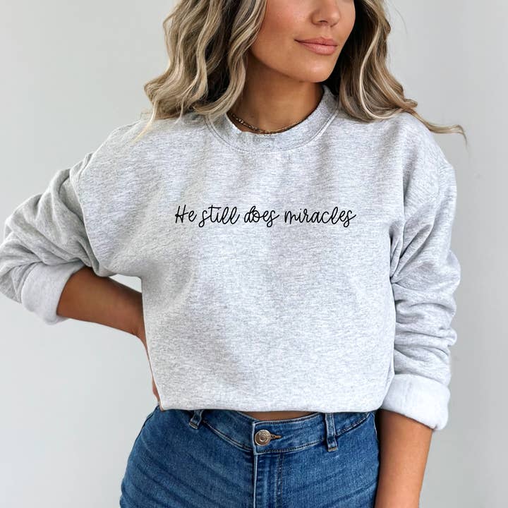 Wholehearted Motherhood and Co. - Wholesale Graphic Sweatshirt - Unisex - He Still Does Miracles Sweatshirt - Graphic Christian Tee