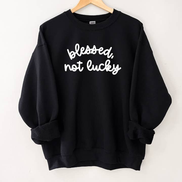 Blessed, Not Lucky zwart sweatshirt voor wholesale door SBG Co.