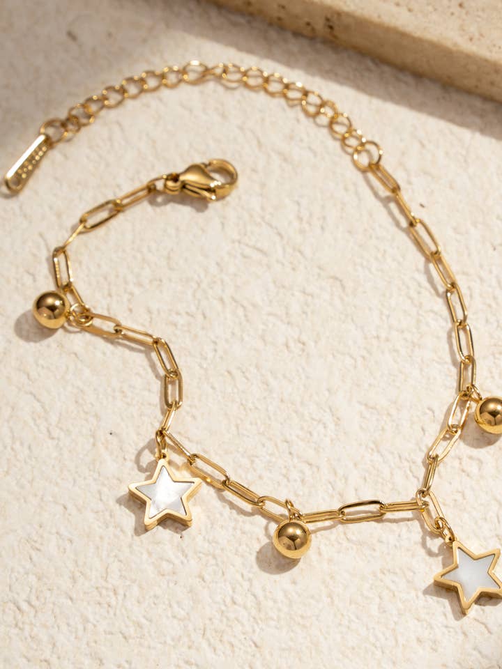 Mother-of-pearl star charm bracelet in stainless steel for wholesale by COSMOS