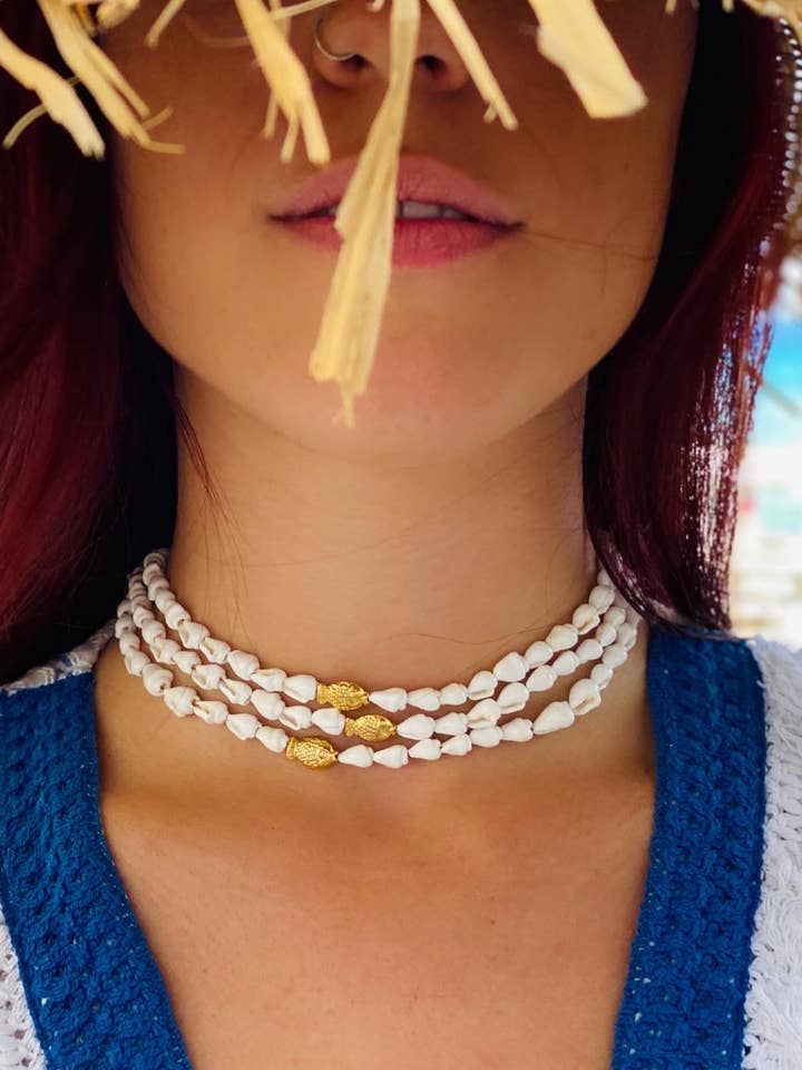 Witte schelpen en goudvis voor wholesale door INO seaside creations