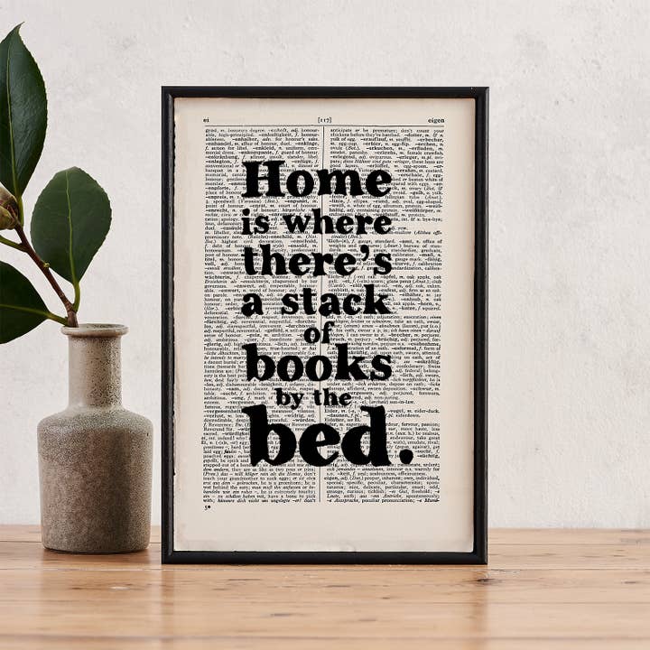 'Home is where there's a stack of books' booklover print for wholesale by Bookishly (US Duties Paid)