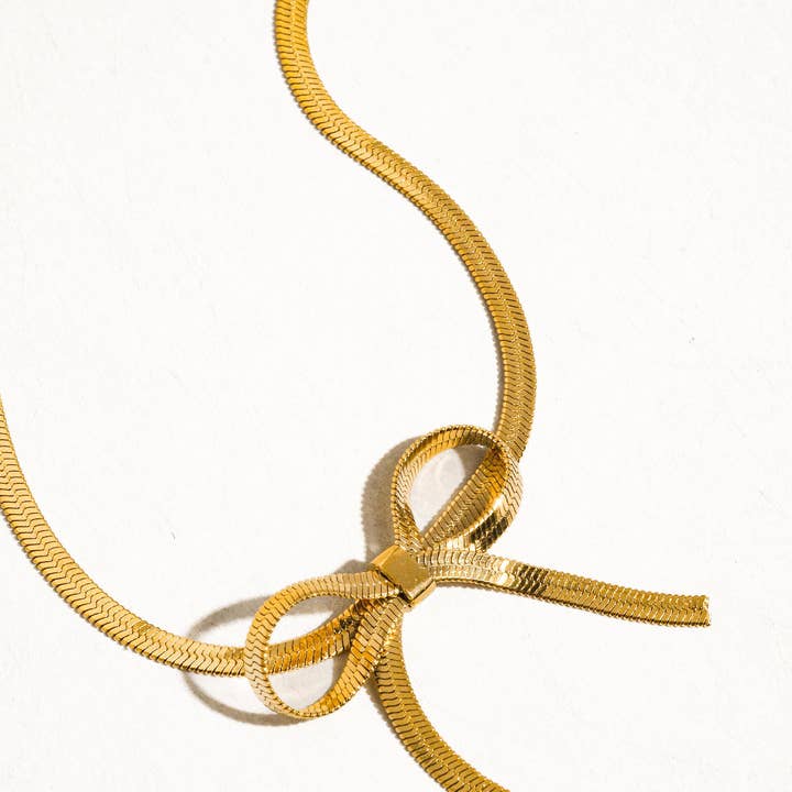 Marie 18K Gold Non-Tarnish Flat Snake Bow Choker for wholesale on Faire