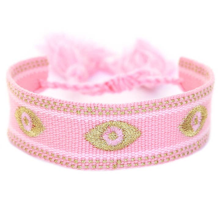 Roze gevlochten armband met gouden evil eye voor wholesale door Love Ibiza