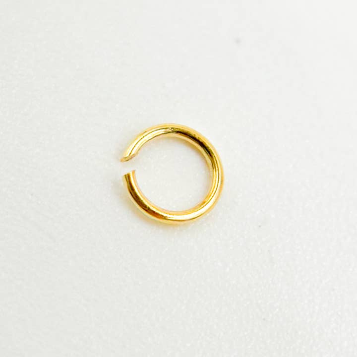 MFT040DE3GP. 3MM_26 Gauge Gold Plated Sterling Silver Open Jump Ring for wholesale by Jewels & Chains