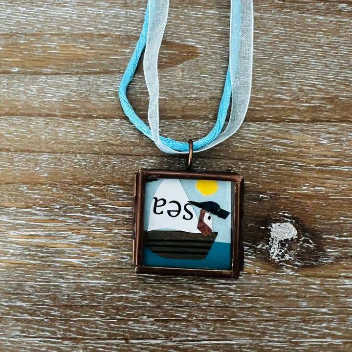 Mini Art Collage Pendant Necklace- Sea Pirate for wholesale by Keely Siebenthal Art & Designs