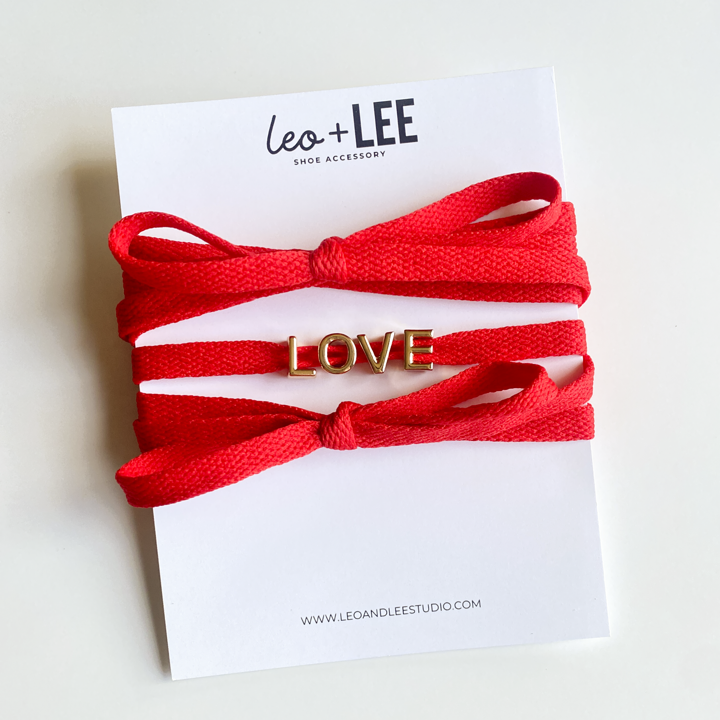 Leo & Lee Studio - Wholesale Shoelaces - Unisex - Love Sneaker Charm Sets - Gold LOVE with Red & White Laces1