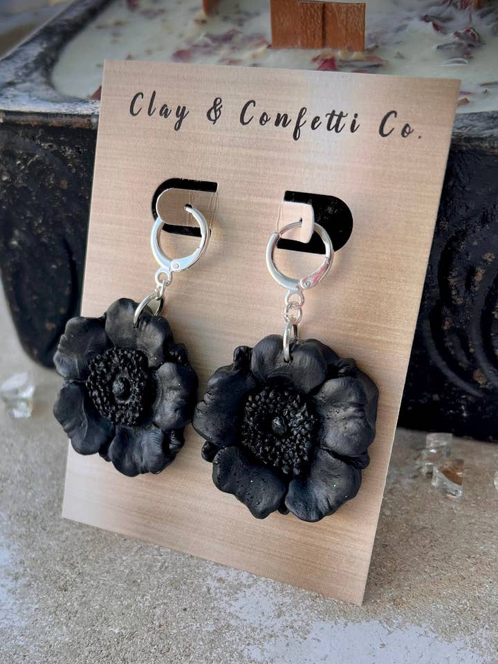 Black poppy clay earring on a silver huggie hoop for wholesale by Clay & Confetti Co.