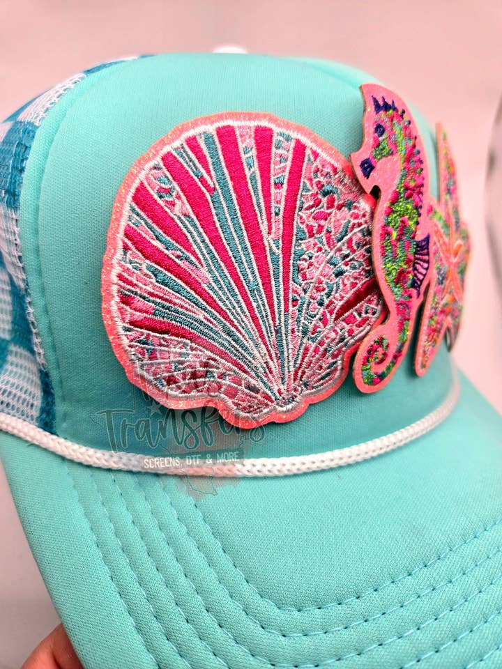 Toppa termoadesiva conchiglia glitter corallo per la vendita all'ingrosso da parte di Texas Transfers