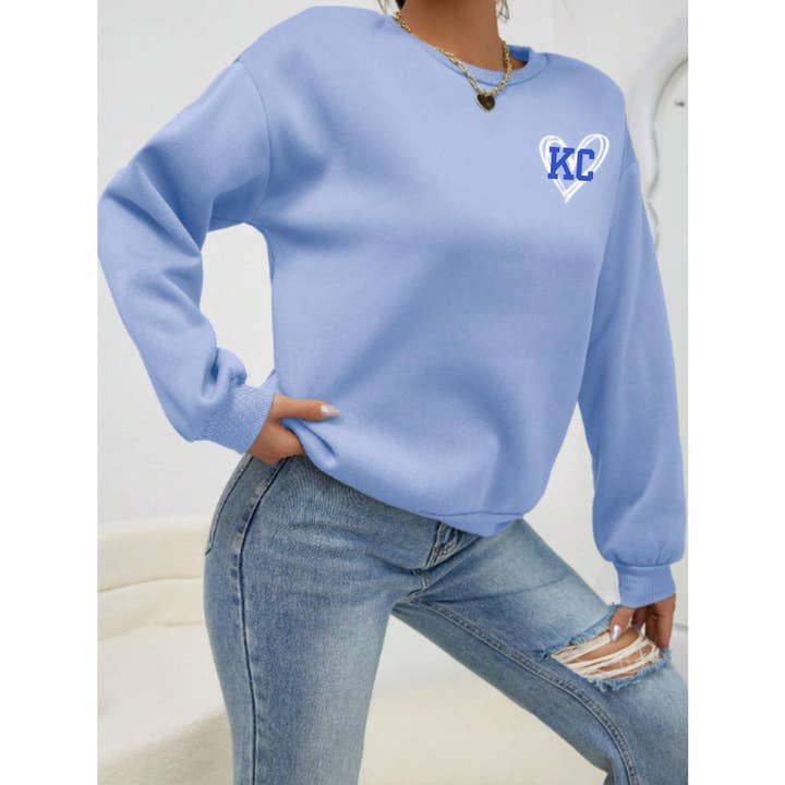 Lichtblauwe KC Pullover Sweatshirt met Hart voor wholesale door Elby Designs Apparel