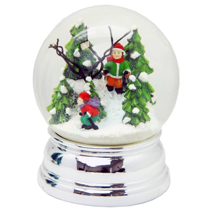 Snow globe skier in winter forest on silver base for wholesale by Schneekugelhaus