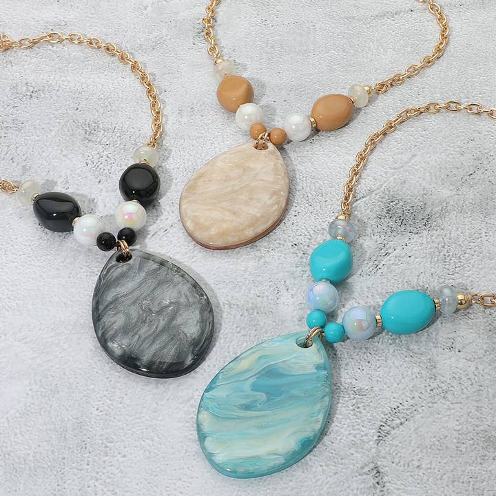 Bold Sparkled Celluloid Acetate Teardrop Pendant Accent Pebble Beaded Statement Necklace for wholesale by Sensibling Corp.