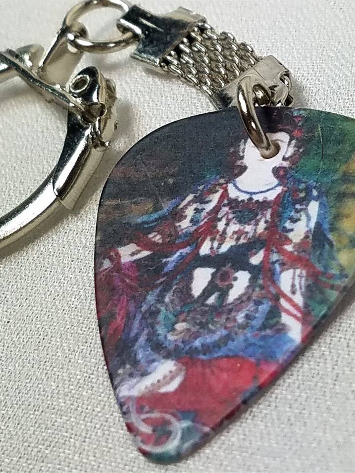 Porte-clés Guitar Pick avec motif bouddhiste pour la vente par Simply Raevyn