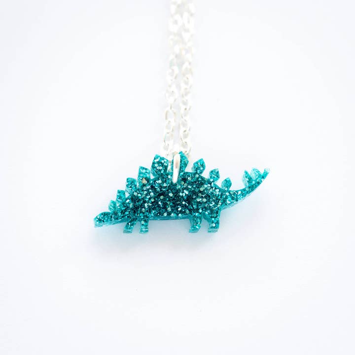 Glitter stegosaurus tiny charm necklace for wholesale by designosaur