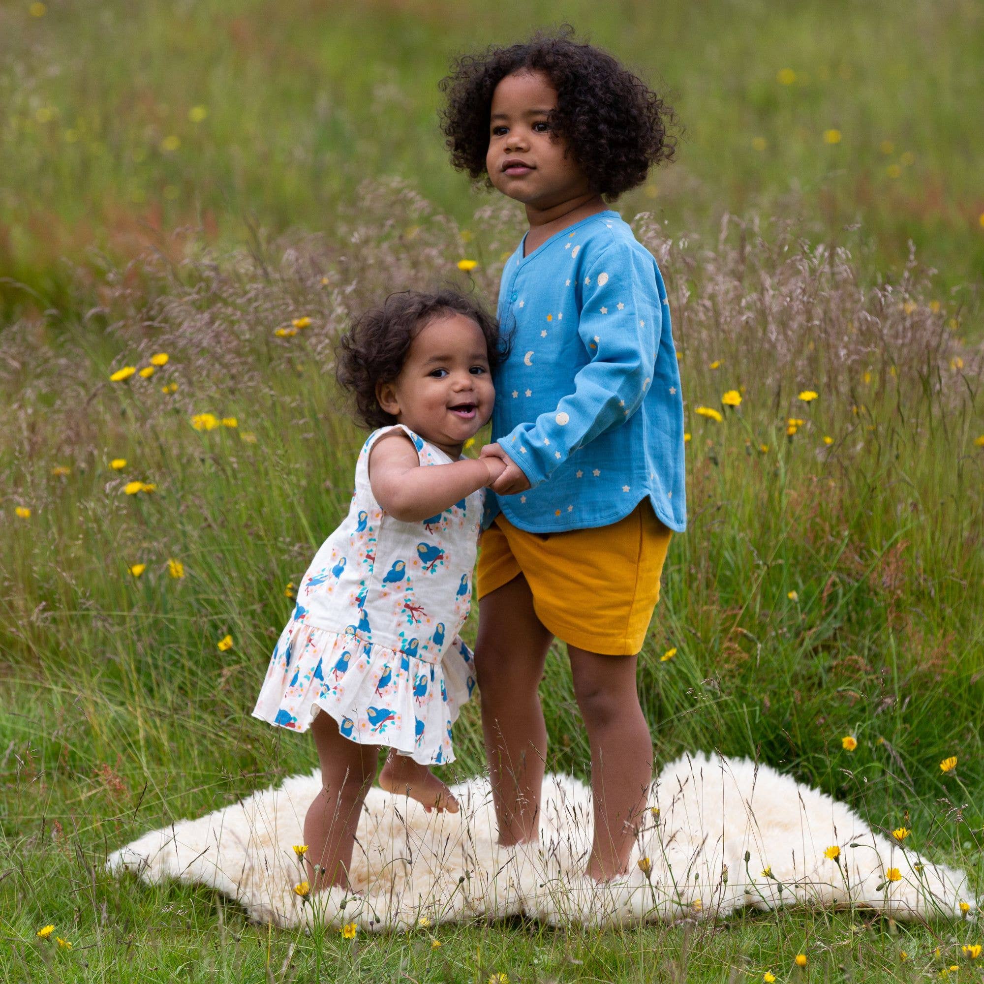 Bluebirds Button Ruffle Romper for wholesale on Faire5