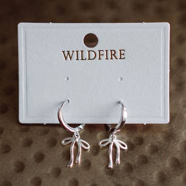 Dainty Bow Huggie Earrings - Silver for wholesale by Wildfire LLC