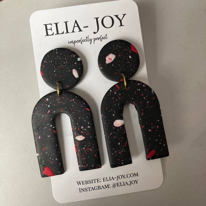 Arco moteado negro para venta al por mayor de Elia-Joy Boutique