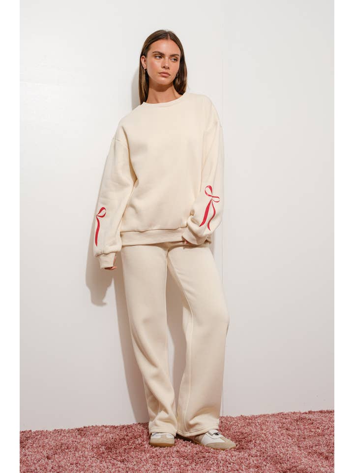 CREAM BOW WIDE LEG SWEATPANTS for wholesale on Faire