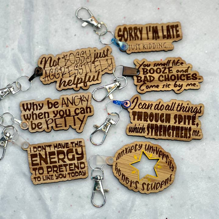 Sjove lasergraverede trænøgleringe for engroshandel hos Madelyn Louise Ink