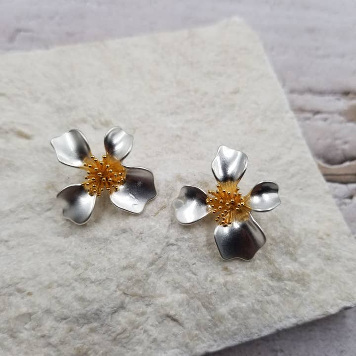 Brave Silver Flower Earrings for wholesale by Treasure Wholesale