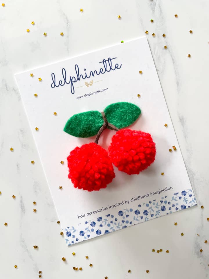 Cherry Pom Pom Hair Tie for wholesale by delphinette