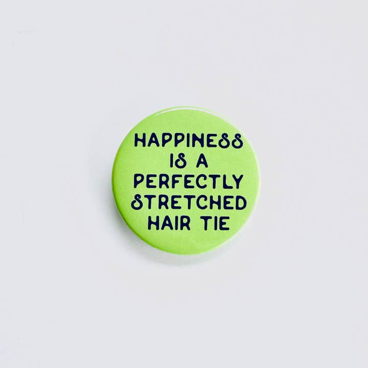 Happiness is perfectly stretched hair tie Pinback button pin for wholesale by The Silver Spider