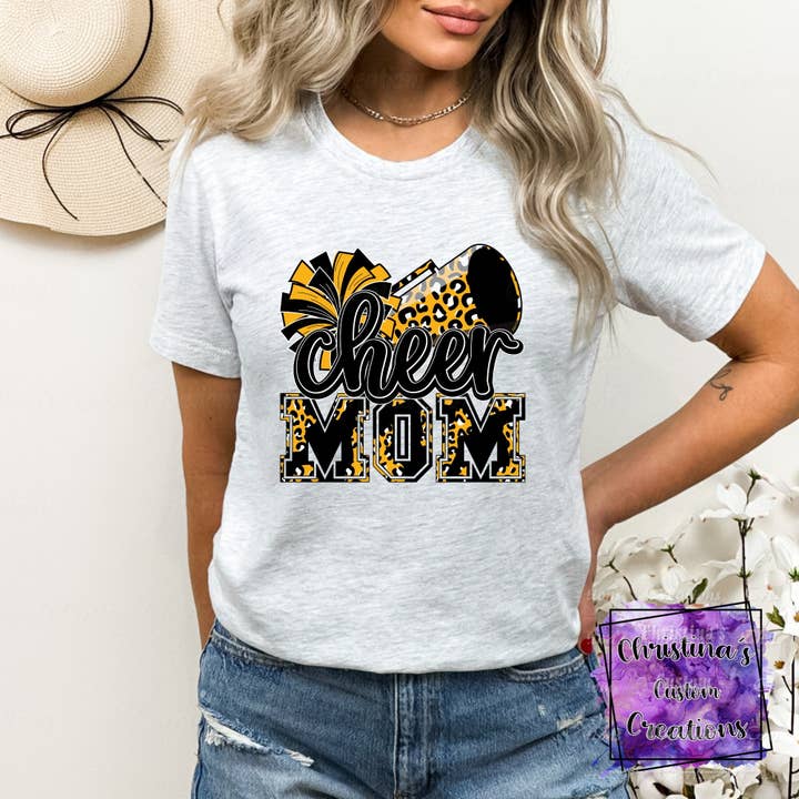 Black and Gold Cheer Mom T-Shirt | Trendy School Spirit Shirt | Fast Shipping | Super Soft Shirts for Men/Women/Kid's | Bella Canvas for wholesale by Red Dirt Transfers
