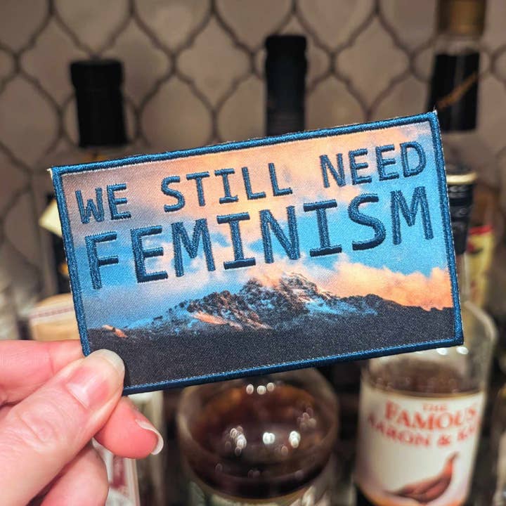We Still Need Feminism iron-on patch (twilight blue version) for wholesale by Cunning Linguist Co.