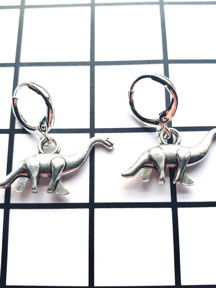 Grønne dinosaurøreringe for engroshandel hos Alien Bratz