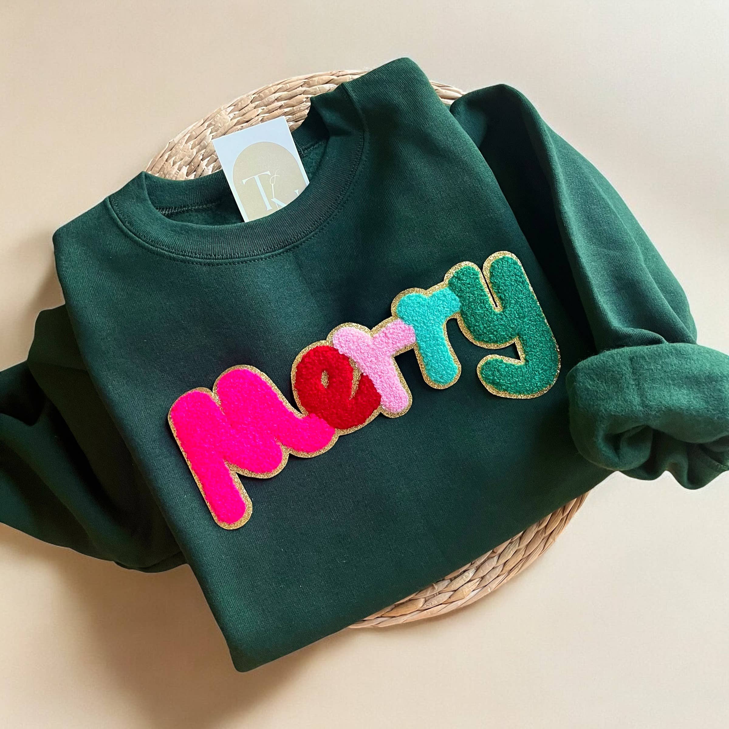 Threads And Needles, INC. - Wholesale Graphic Sweatshirt - Women's - Chenille Patch Merry Christmas Sweatshirt Holiday Sweaters
1