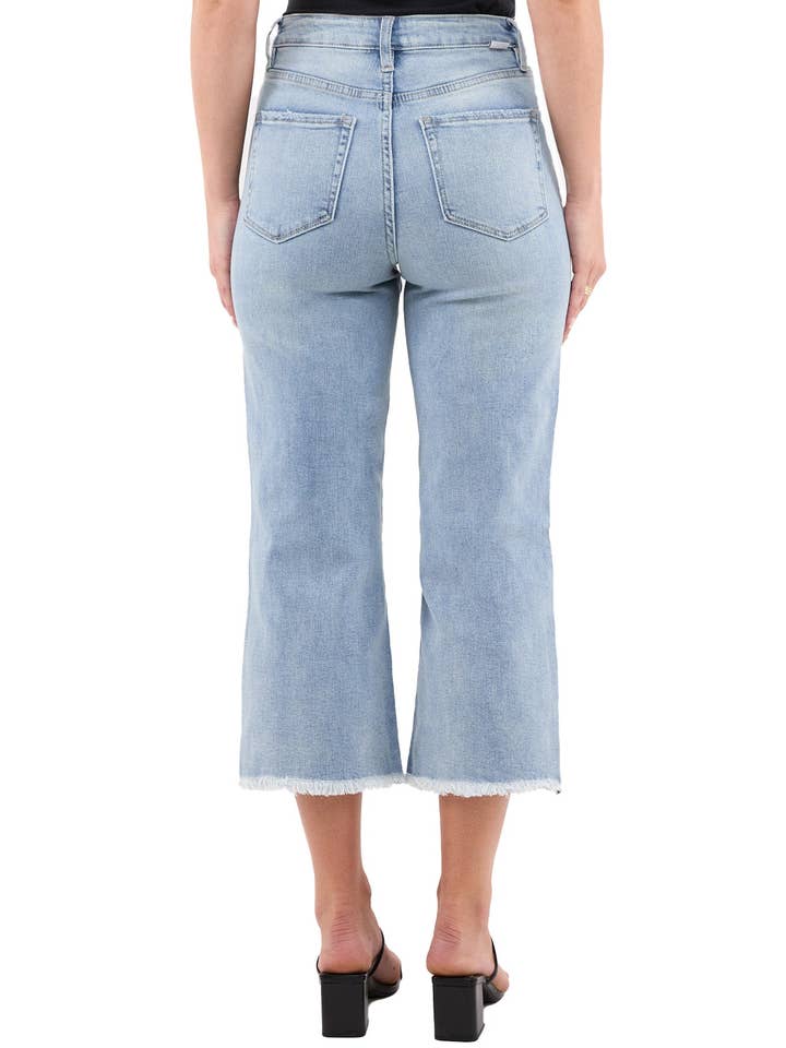 Rippad lätt tvätt Chloe högmidjade vida avklippta jeans med fransar för wholesale på Faire