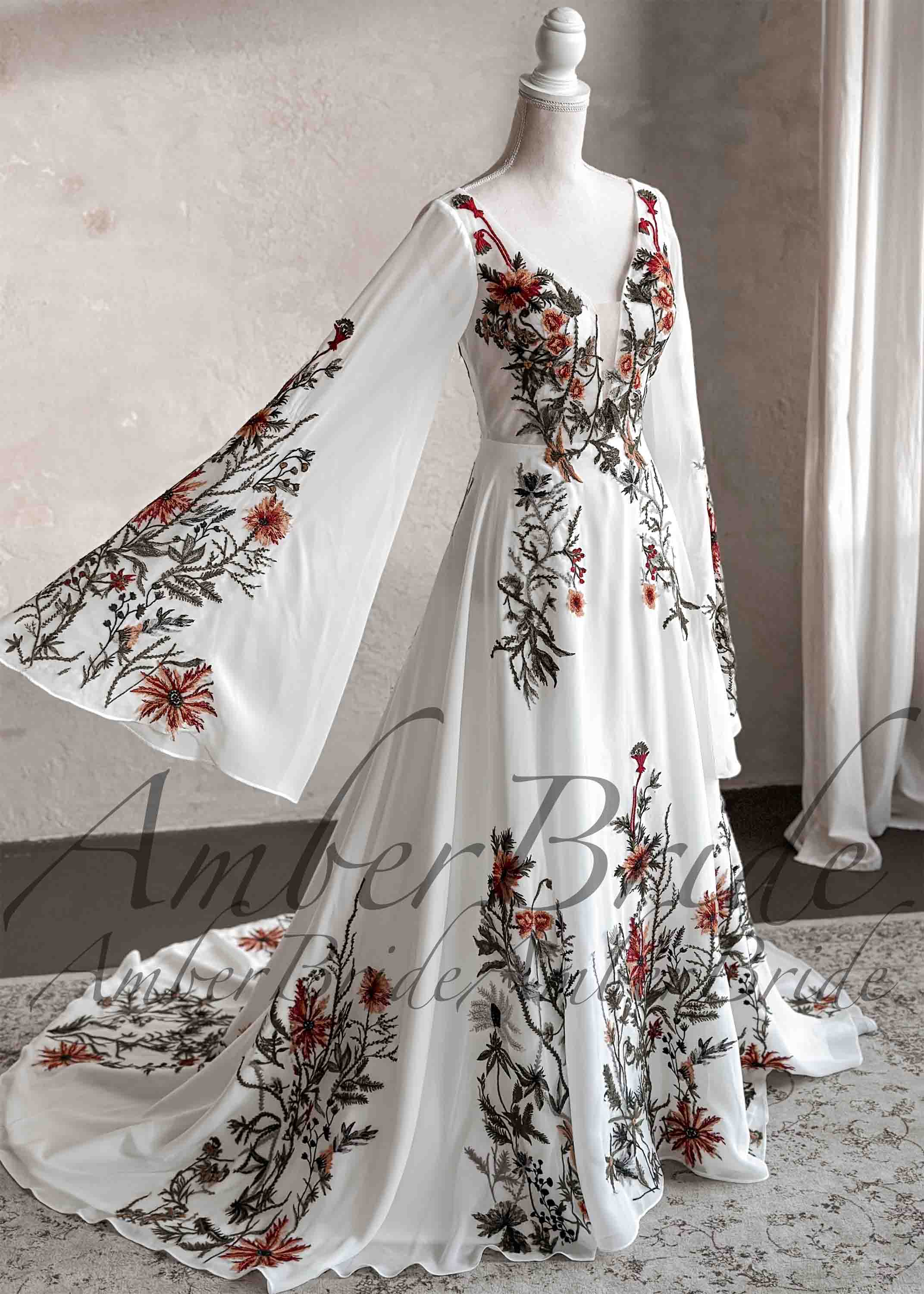 Amber Commerce Group, MB - Wholesale Gown - Women's - Embroidered Floral Details with Cape Sleeves and Chiffon Skirt