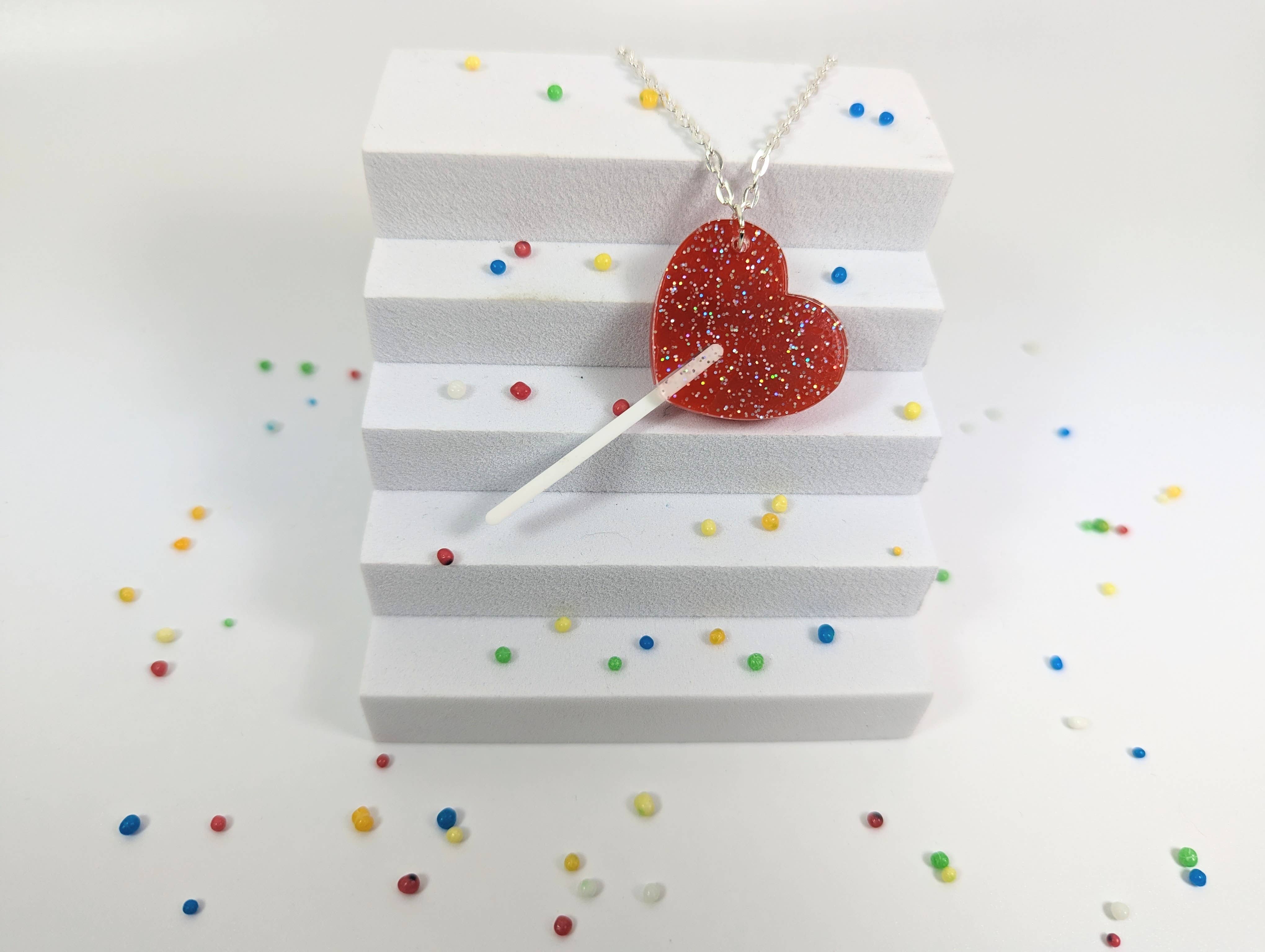 Chikai Shop – wholesale Pendant/charm necklace – Lollipop heart necklace on acrylic with silver plated chain3