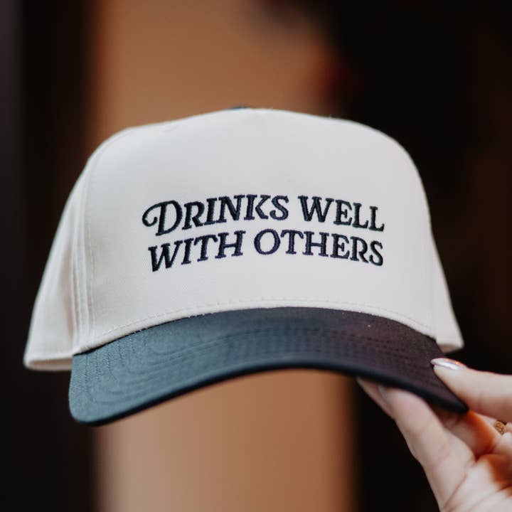 Black and Tan Drinks Well With Others Vintage Trucker Hats For Women for wholesale on Faire